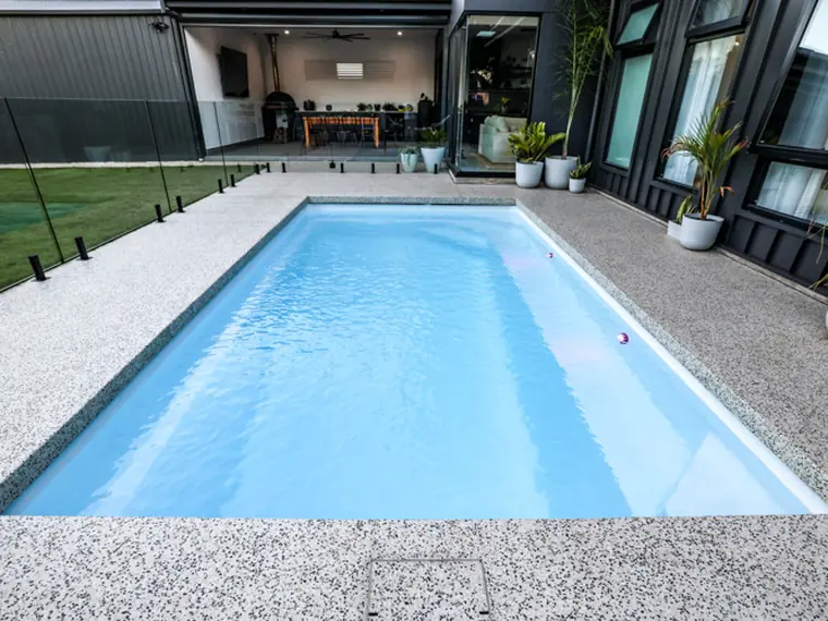 Heron Series compact pool running down the side of a house
