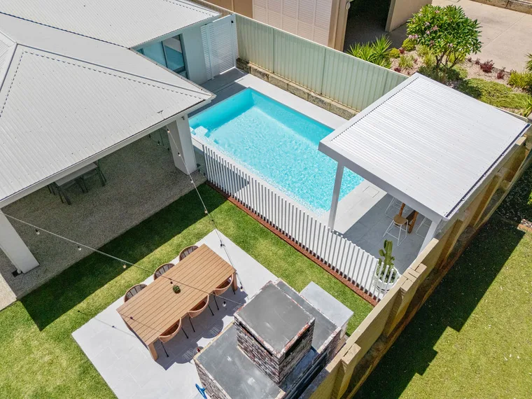 Heated Hamilton fibreglass pool in a Wollongong backyard with covered alfresco